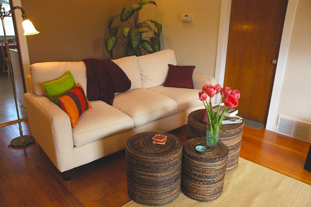 A low sofa, a deep rug and tables pulled close get you the sunken-room feeling without digging