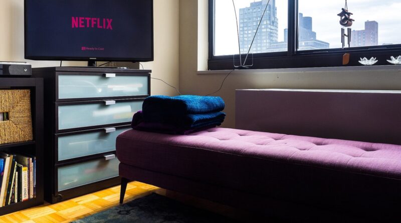 Netflix on a smart TV - a viewer settling in to watch a series at home