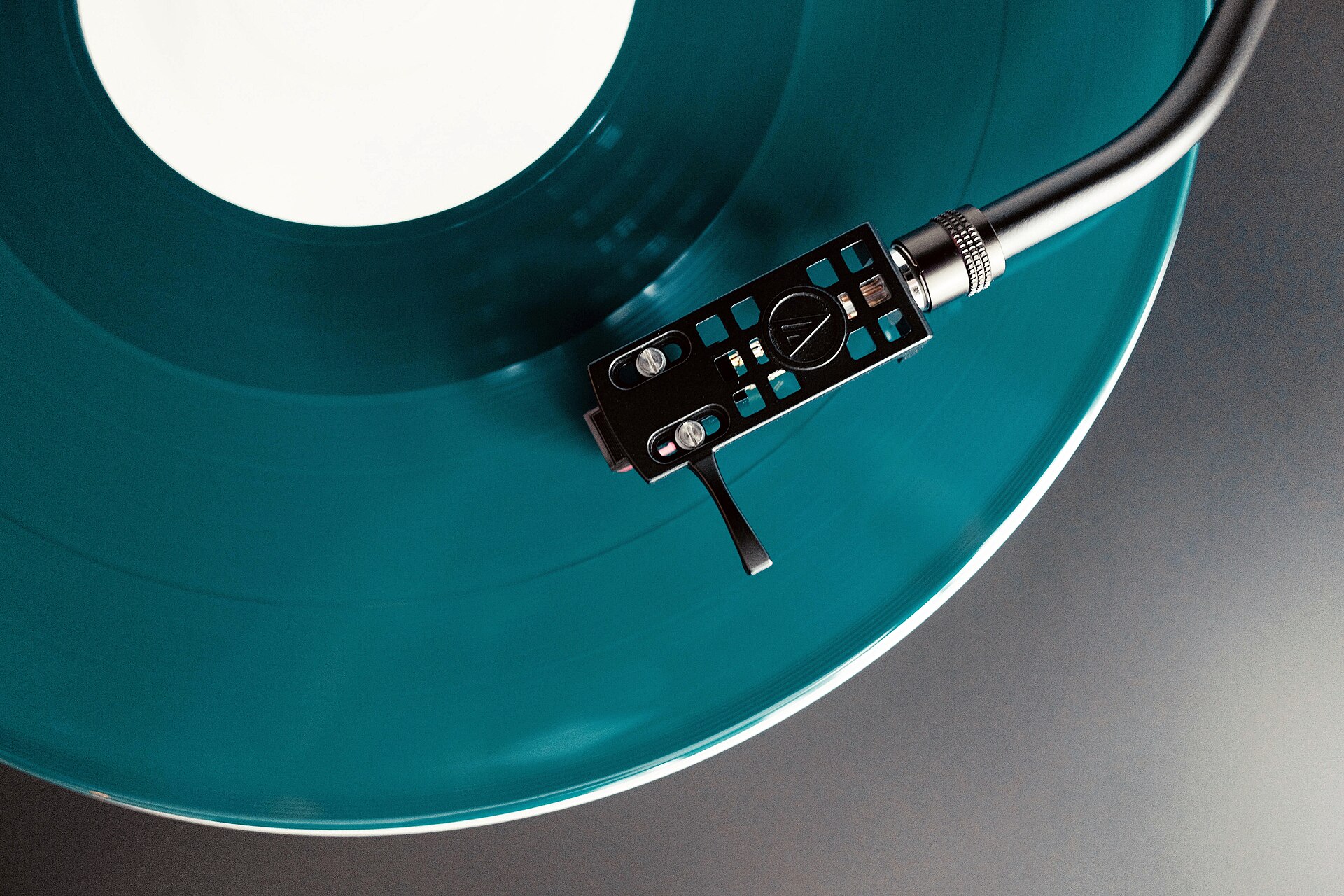 A turntable playing one of the best British albums of 2026 on coloured vinyl