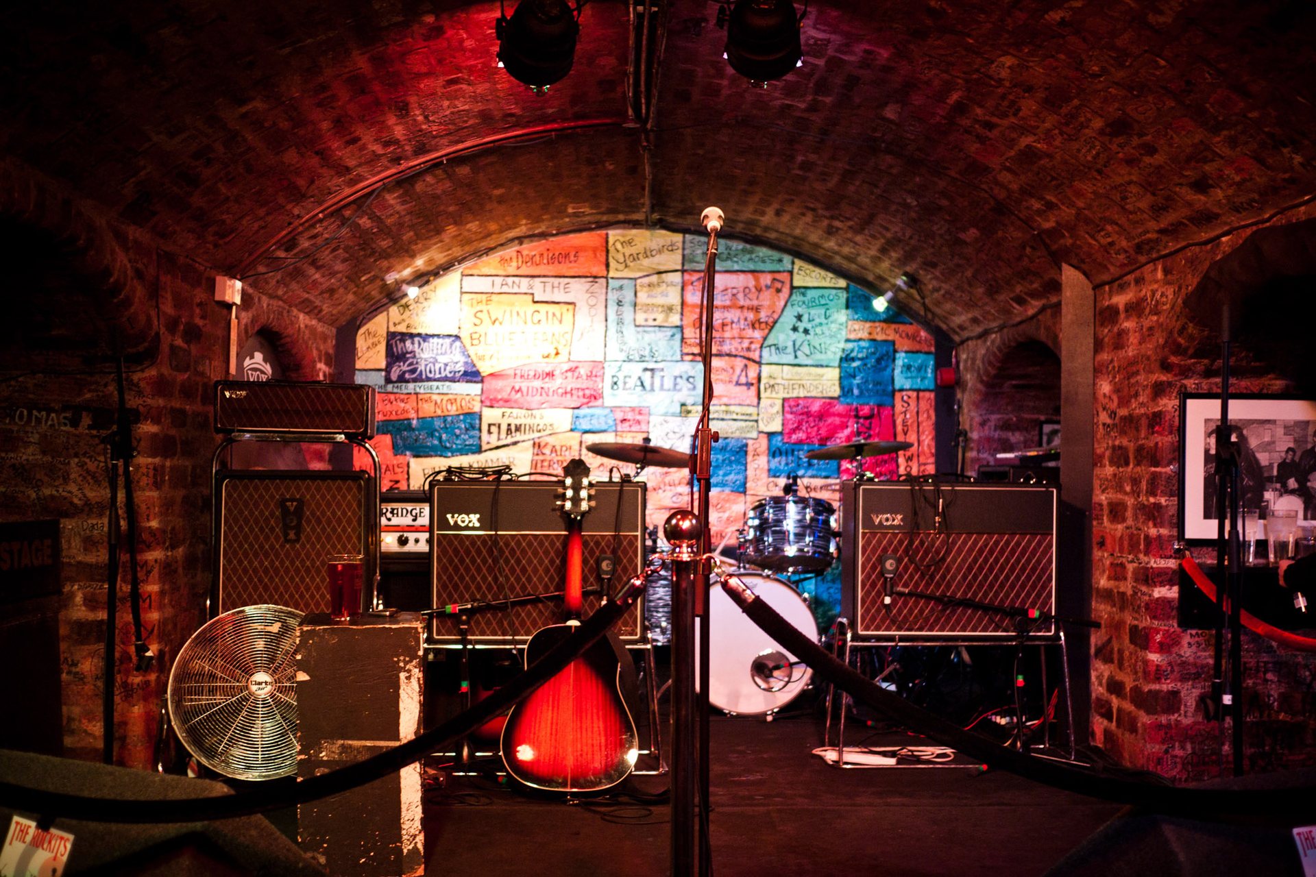 Empty club stage with microphone stand in a small British music venue