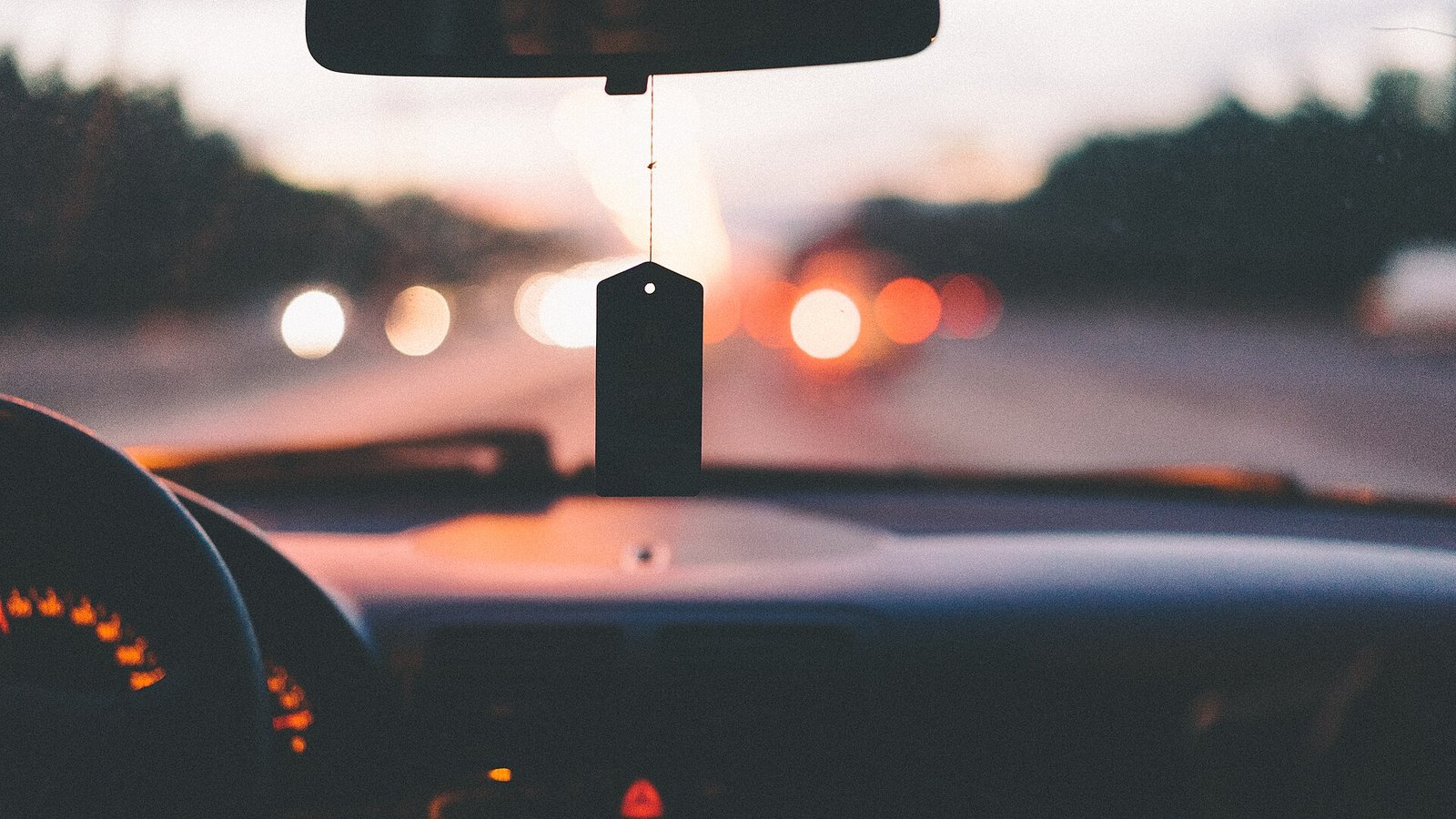 Car dashboard and windscreen view on a motorway - choosing the best dash cam under £100 starts with what it can see