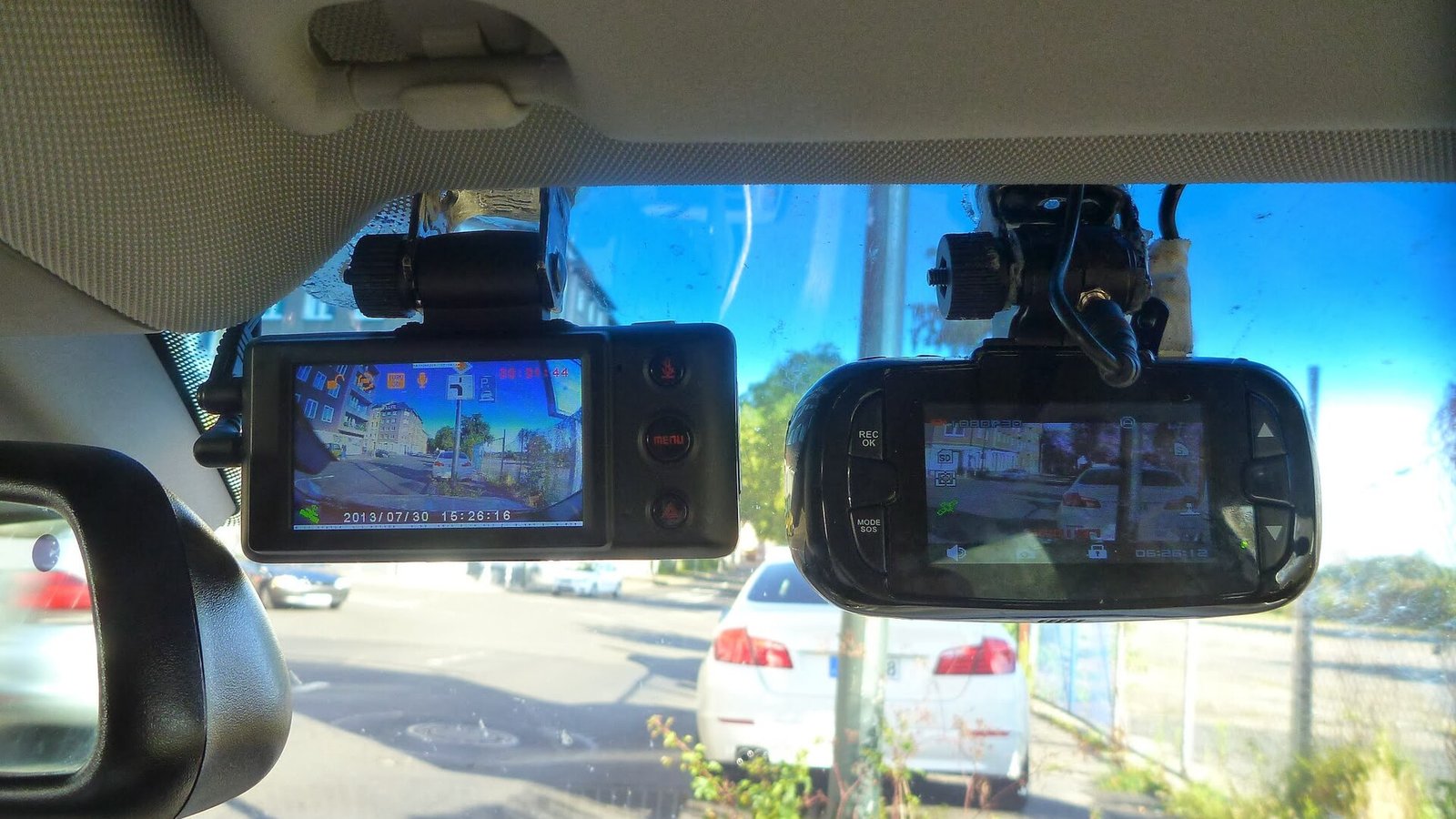 A row of compact dash cams on display, the style that dominates the under £100 market