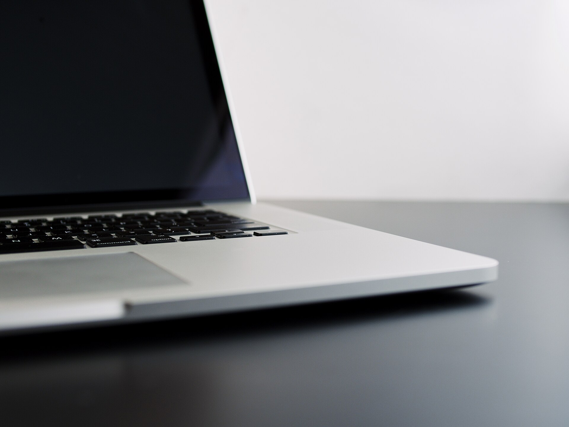Close-up of a budget laptop keyboard and screen