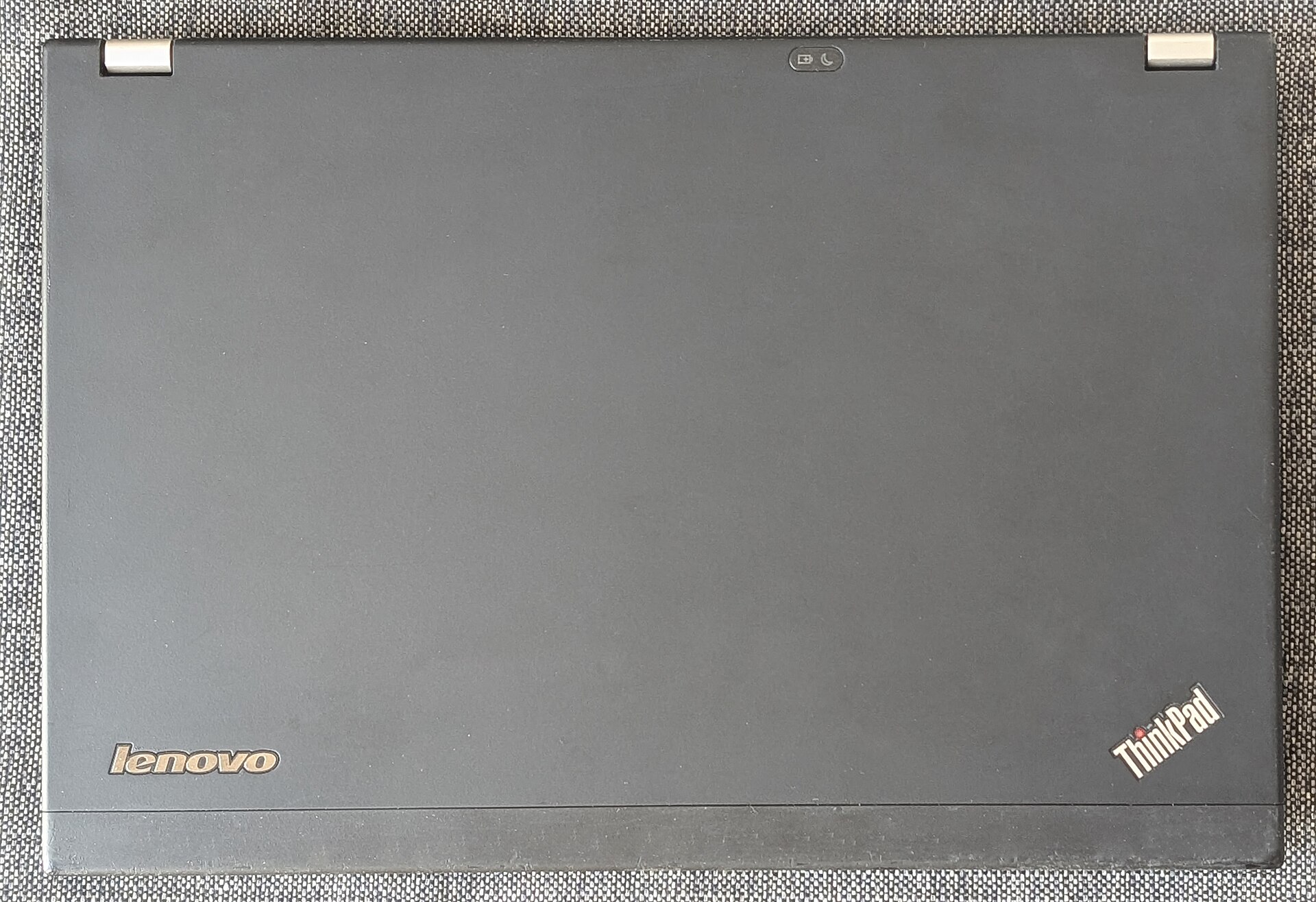 Closed Lenovo ThinkPad laptop showing its matte black lid