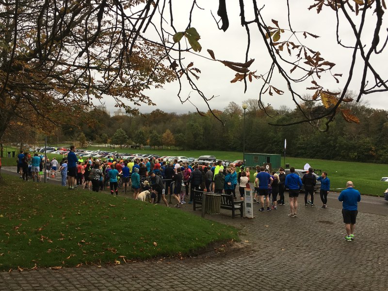 Runners gathering at the start line of a Saturday morning parkrun in a UK park