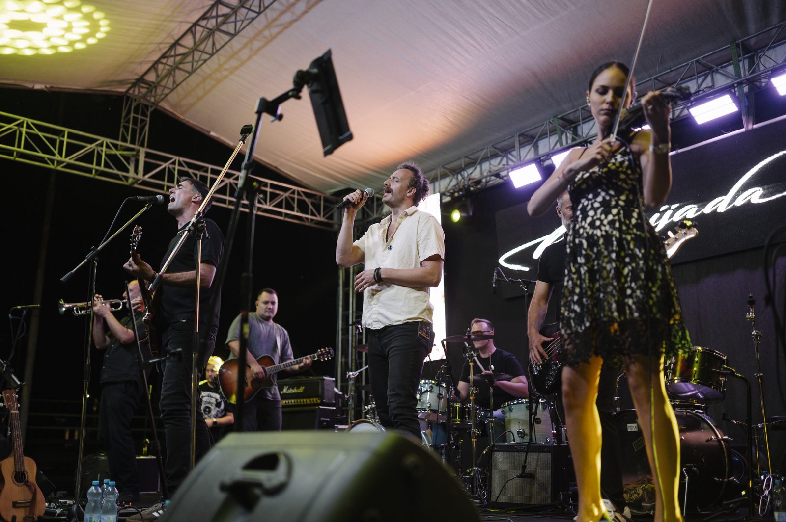 Festival crowd watching a band on the main stage in summer - the best power bank for festivals UK setups stays in your pocket all set