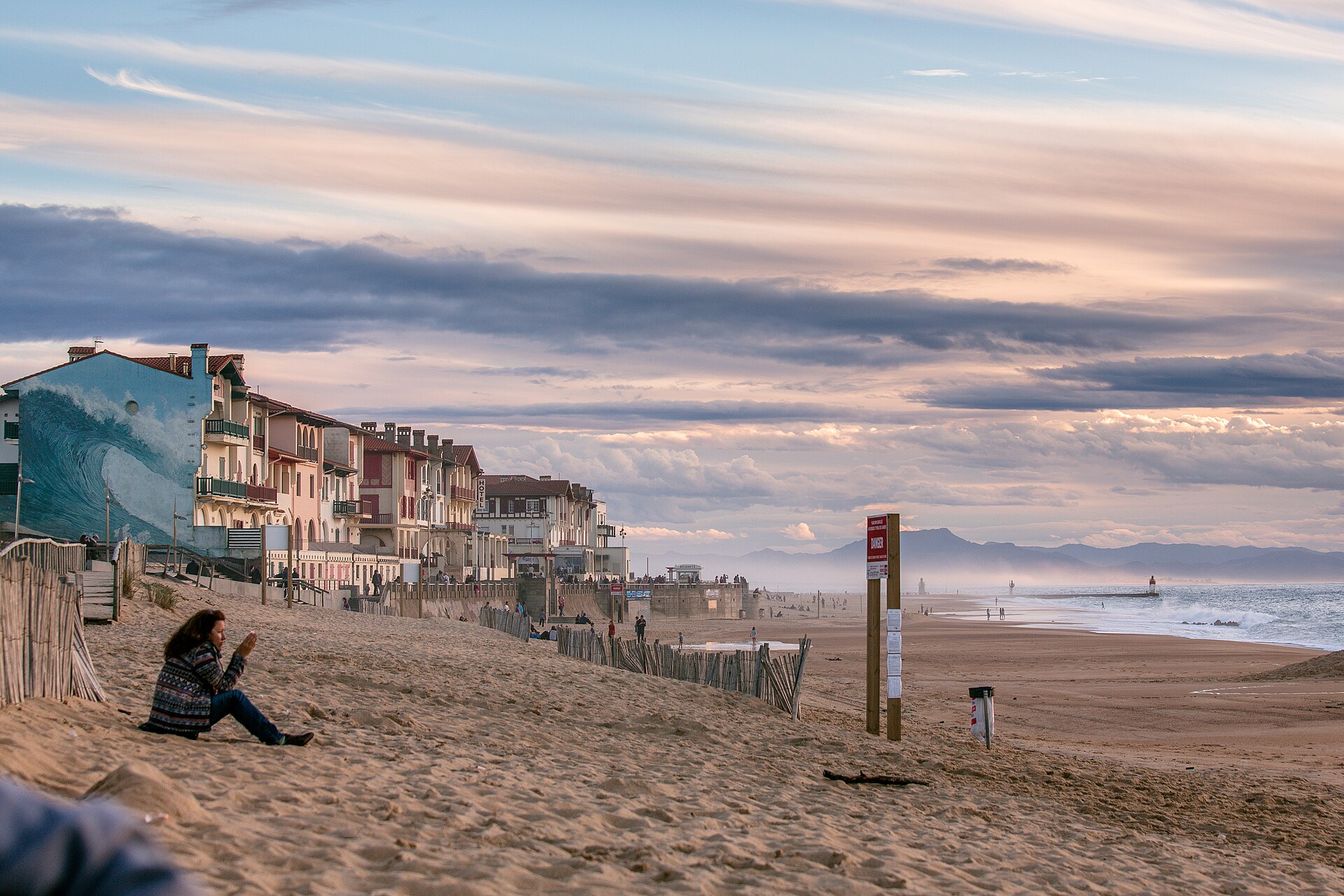 A quiet beachfront in the south of France at dusk, the setting that summer novels like Sunstruck trade on