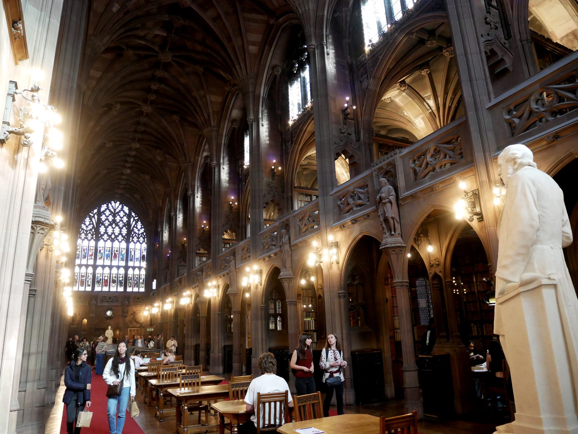 The reading room of the John Rylands Library in Manchester, all stone arches and quiet desks