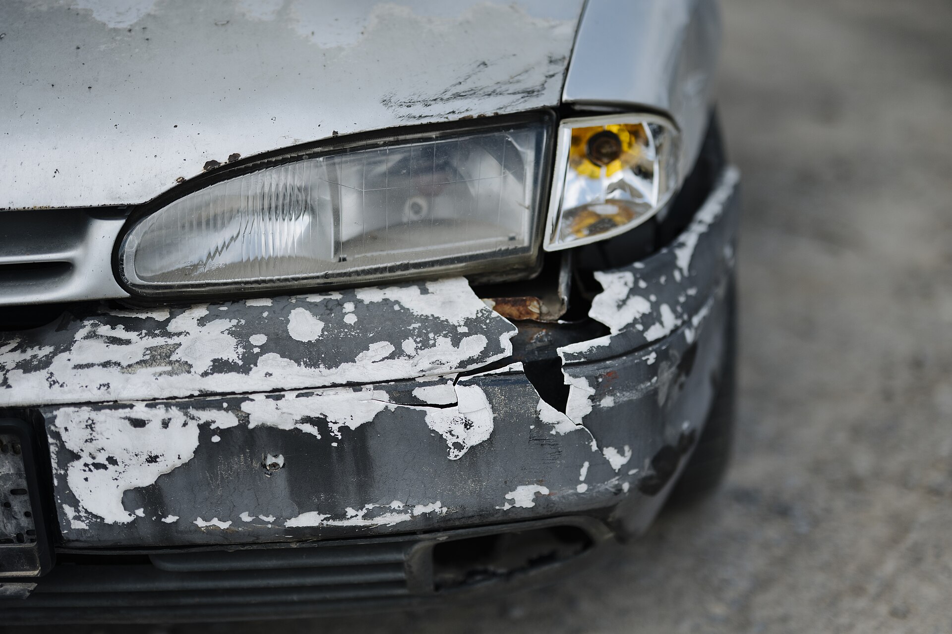 Scuffed front bumper on a car - the kind of minor damage hire firms charge a full excess against