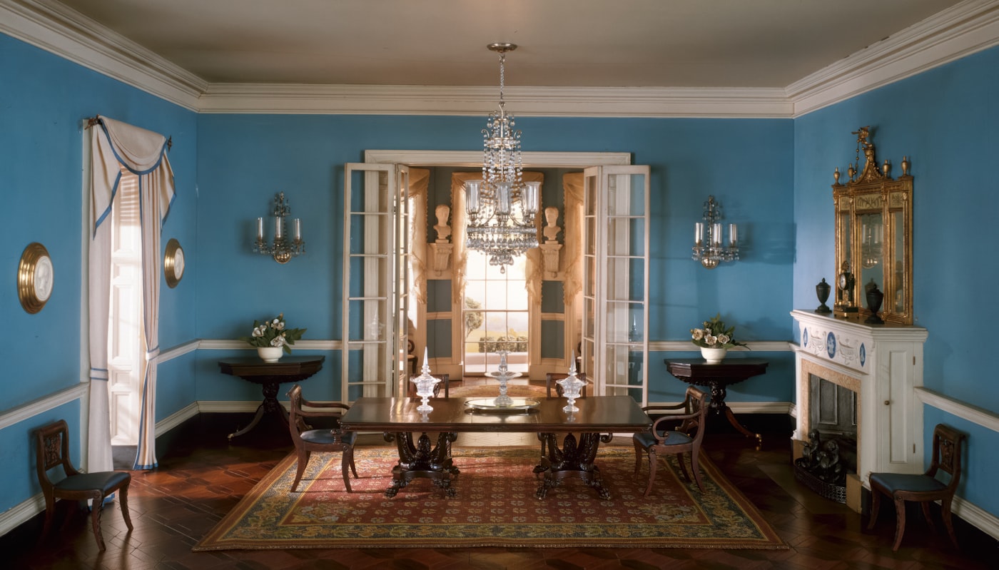 Blue dining room with walls and ceiling softened by a single colour scheme
