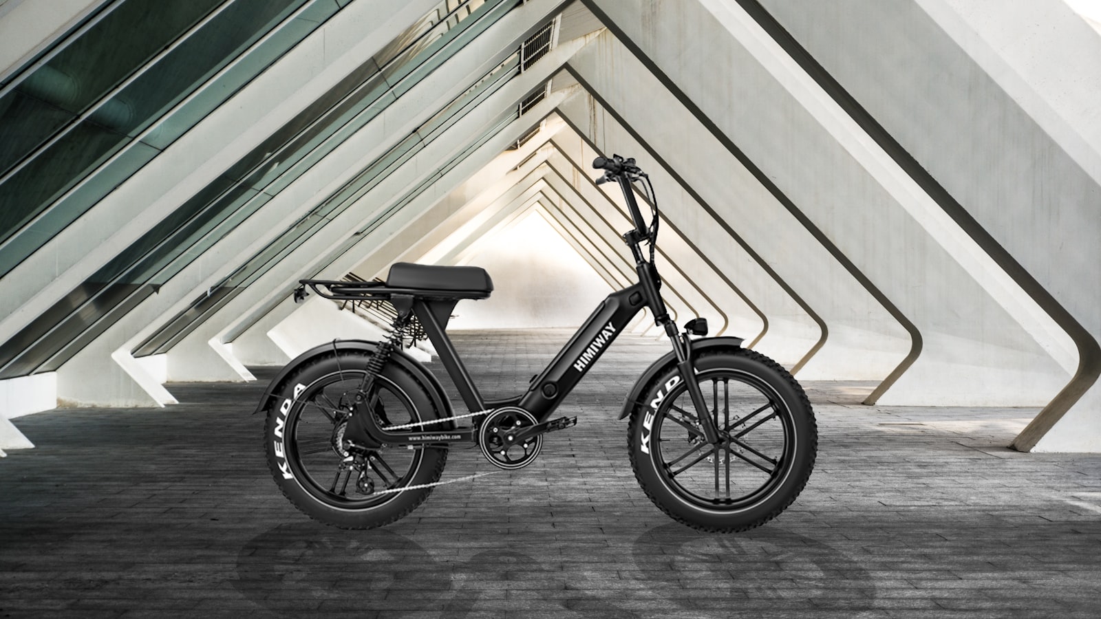A hub-motor electric bike photographed against a concrete wall