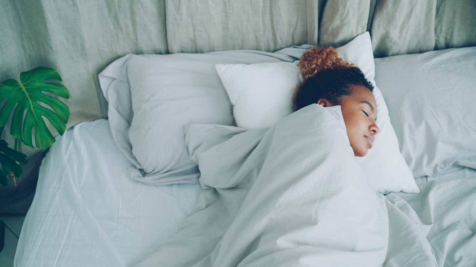 A woman sleeping peacefully, the most effective cortisol detox strategy there is