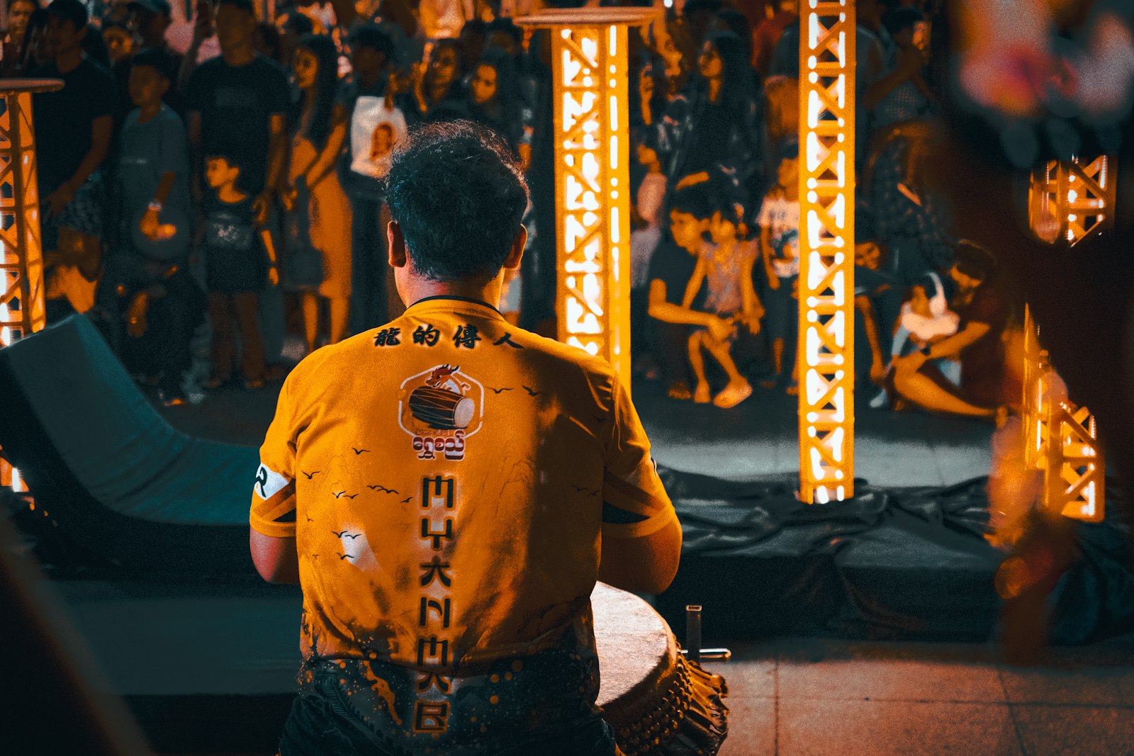 Street performer drumming for a festival crowd
