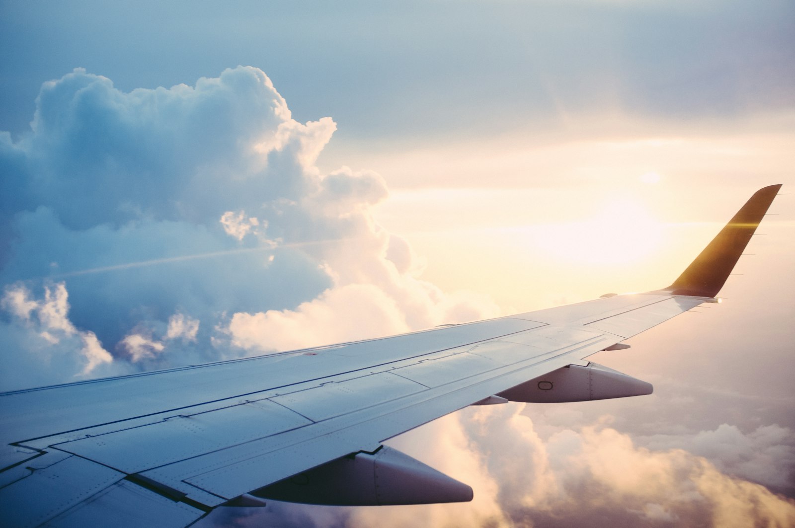 View over a plane wing at sunset - an eSIM for Europe is installed before the flight, not after landing