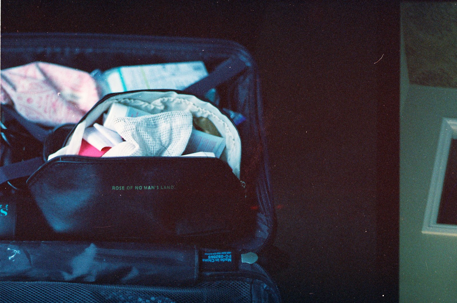 A soft cabin bag packed for a week away within airline size limits