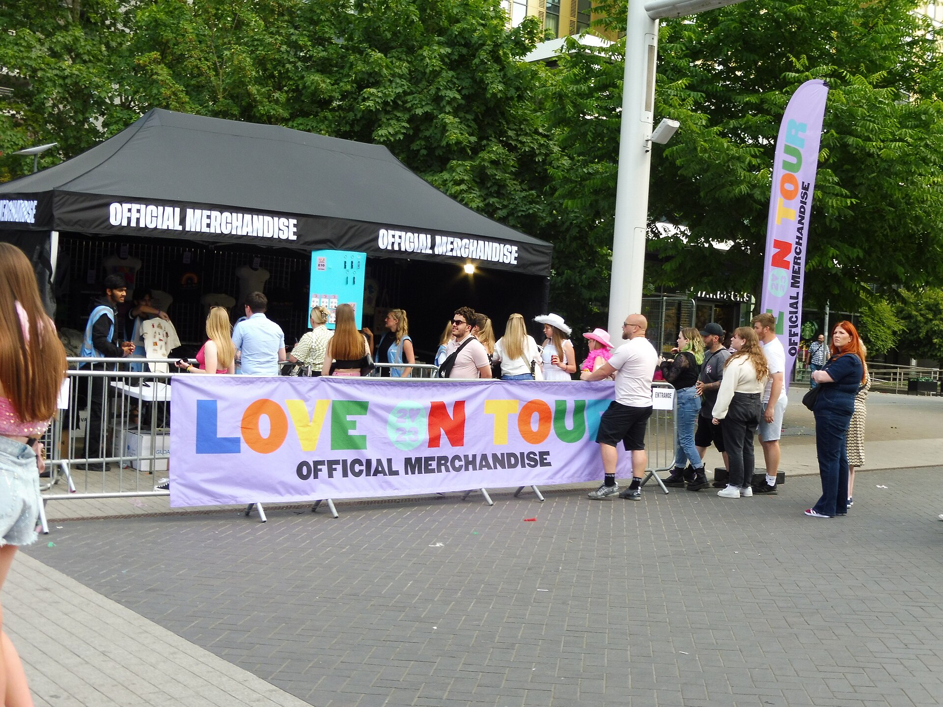 Merchandise stalls and fans on Olympic Way during the Harry Styles Wembley 2026 residency