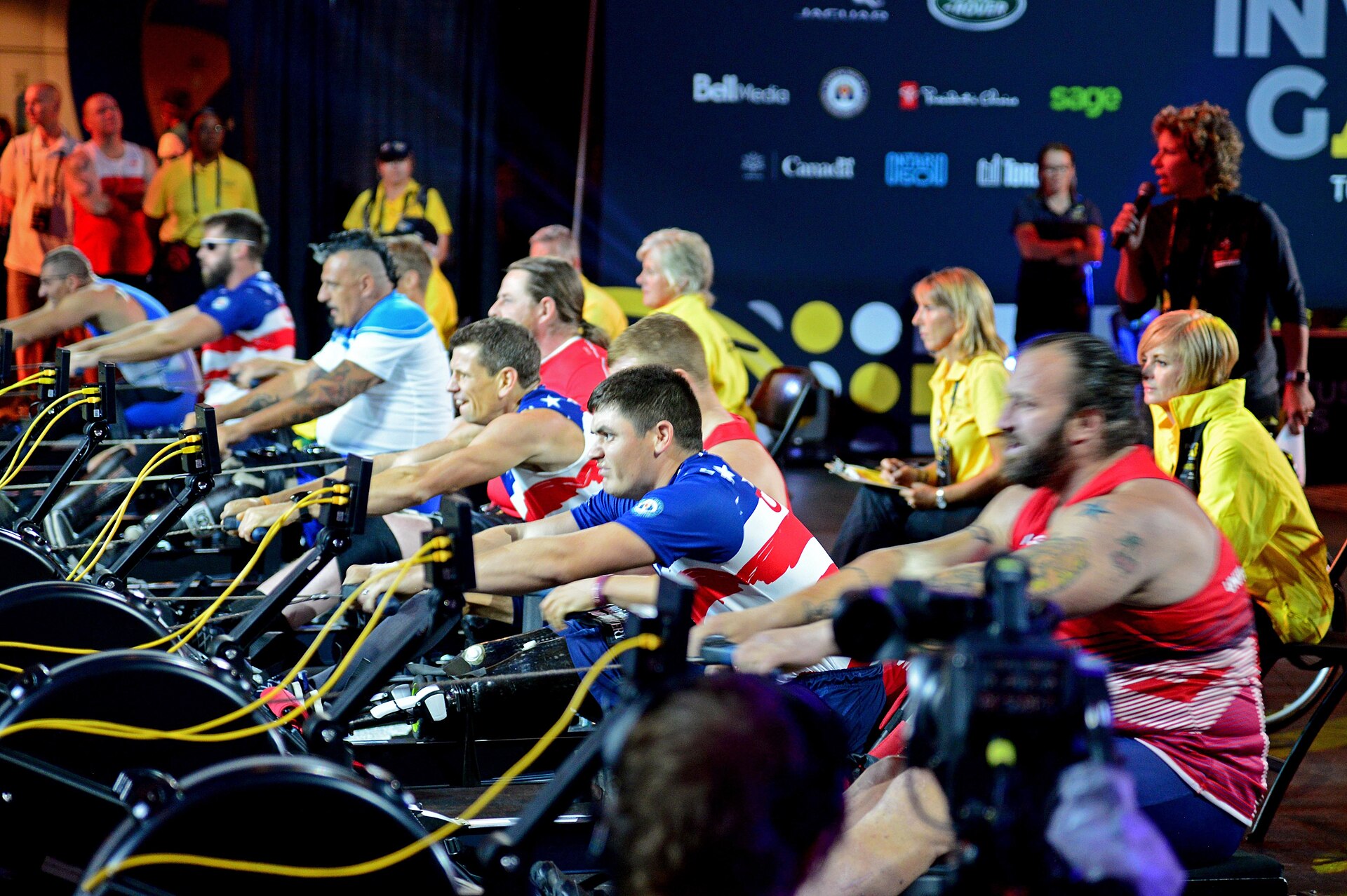 Rowers mid-race at an indoor competition - the 1,000m row is one of eight Hyrox stations
