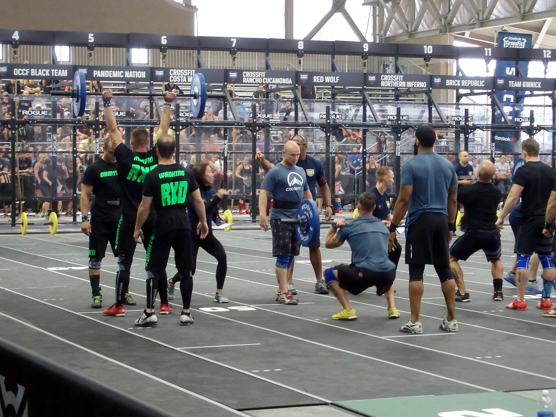 Team competitors waiting to start at a functional fitness competition