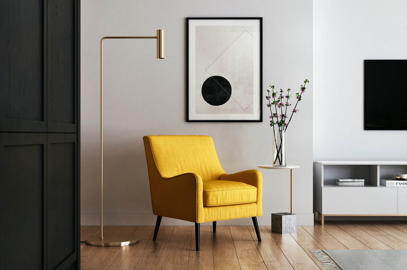 Brass floor lamp beside a yellow armchair in a modern sitting room