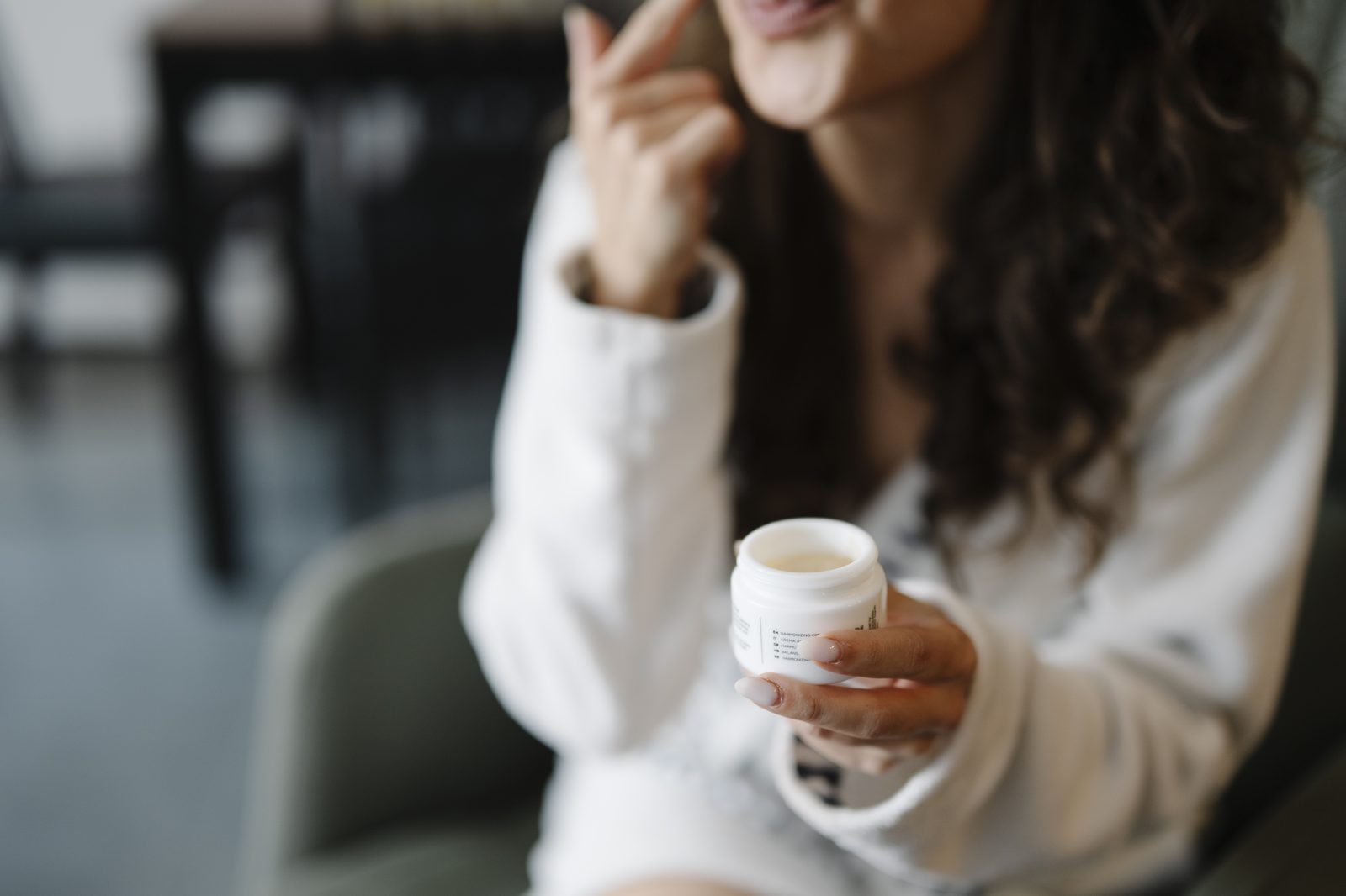 Woman applying face cream, the heavier moisturising step at the heart of menopause skincare