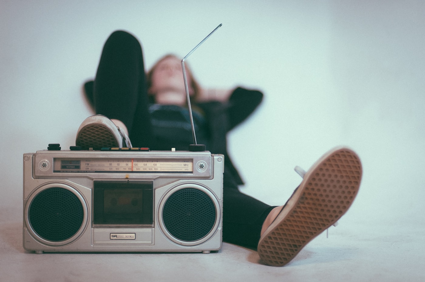 Woman listening to a radio at home