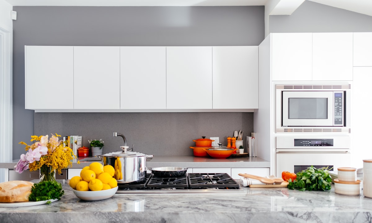 Open-plan kitchen worktop with appliances and cookware on display
