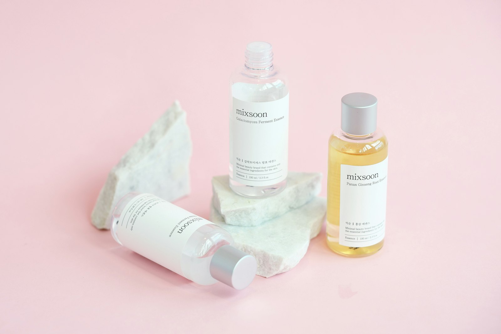 PDRN skincare serum bottles arranged on marble