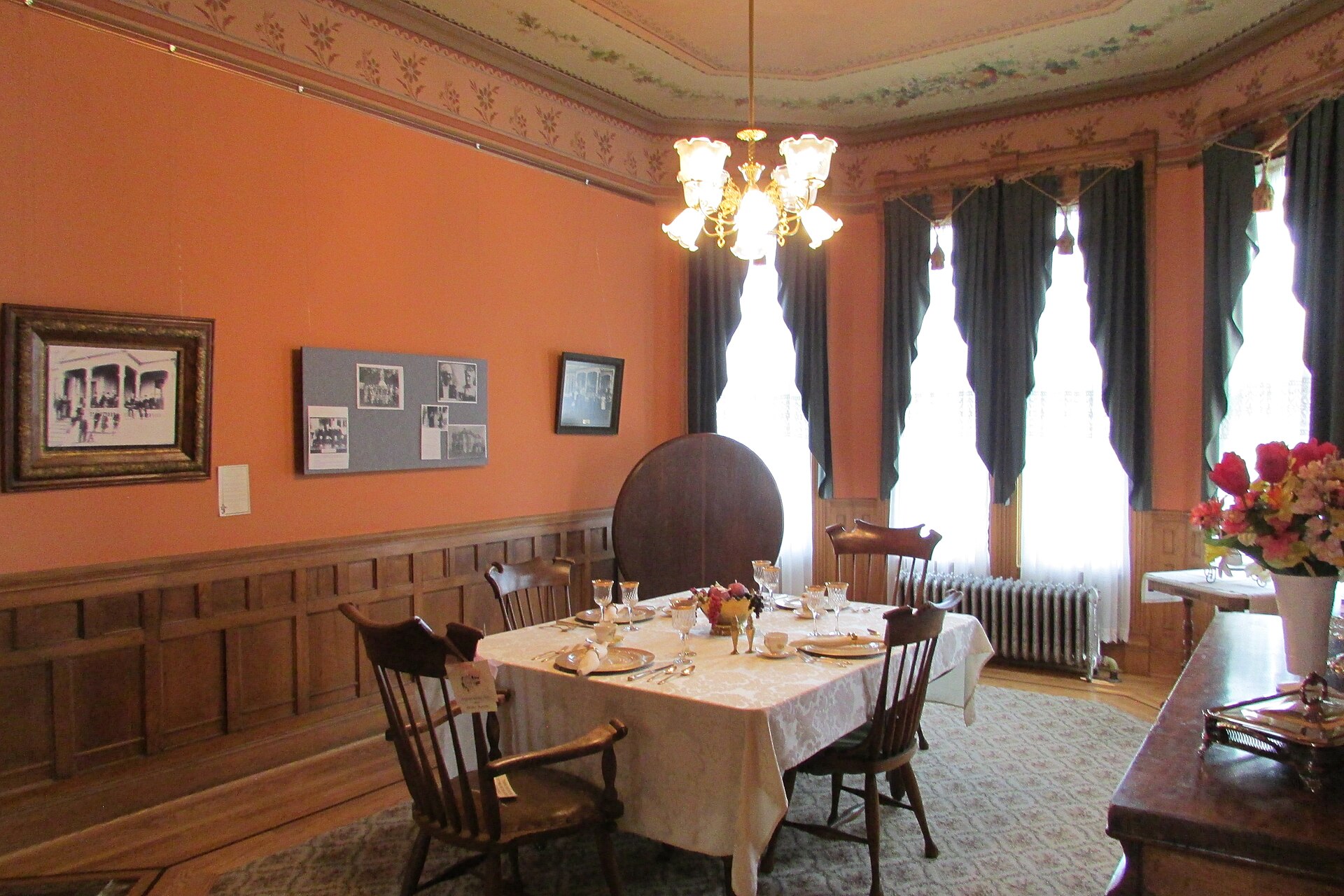 Traditional Victorian dining room with panelling and a formally laid table
