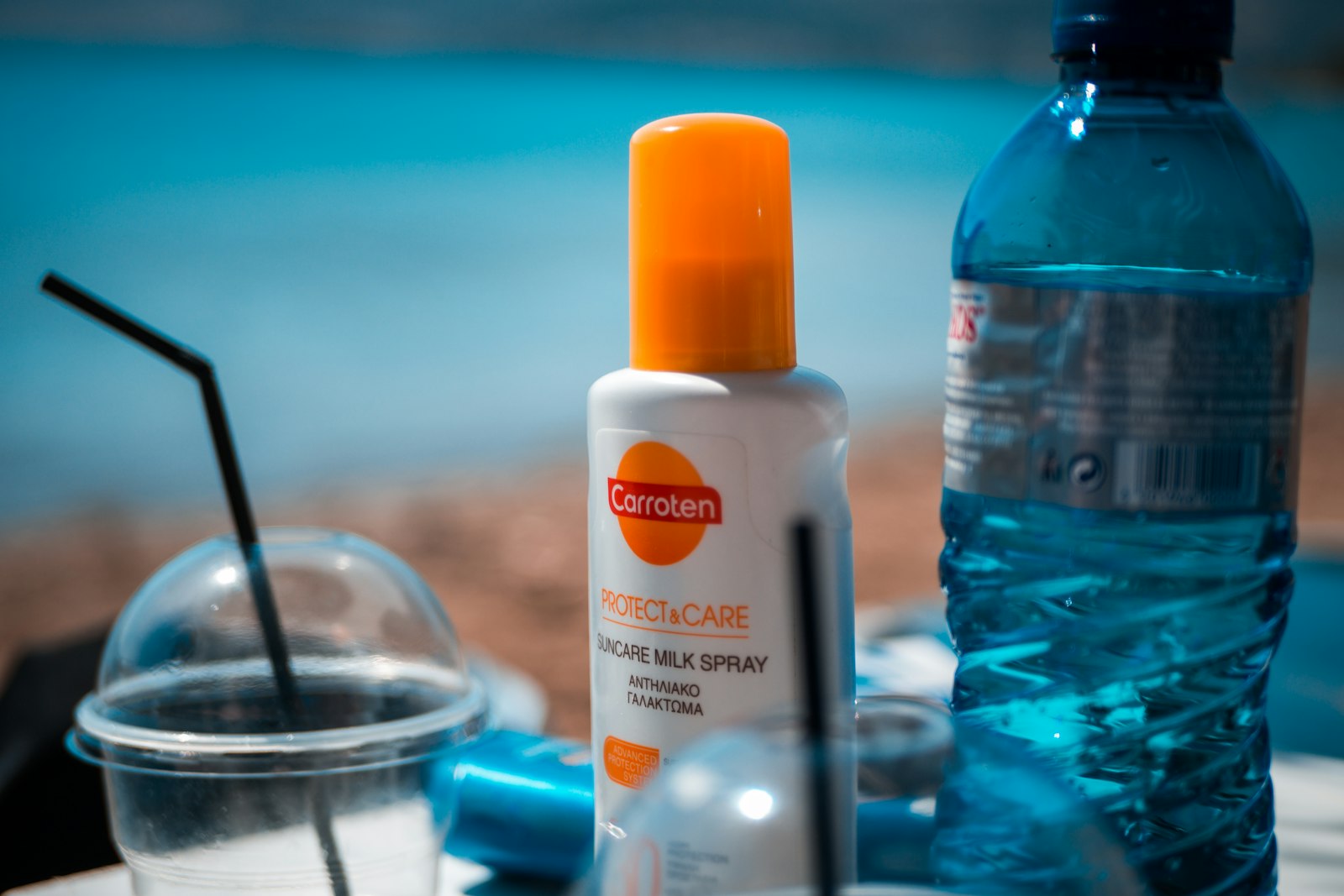 Sunscreen bottle on a table - checking the UVA logo and star rating on the label