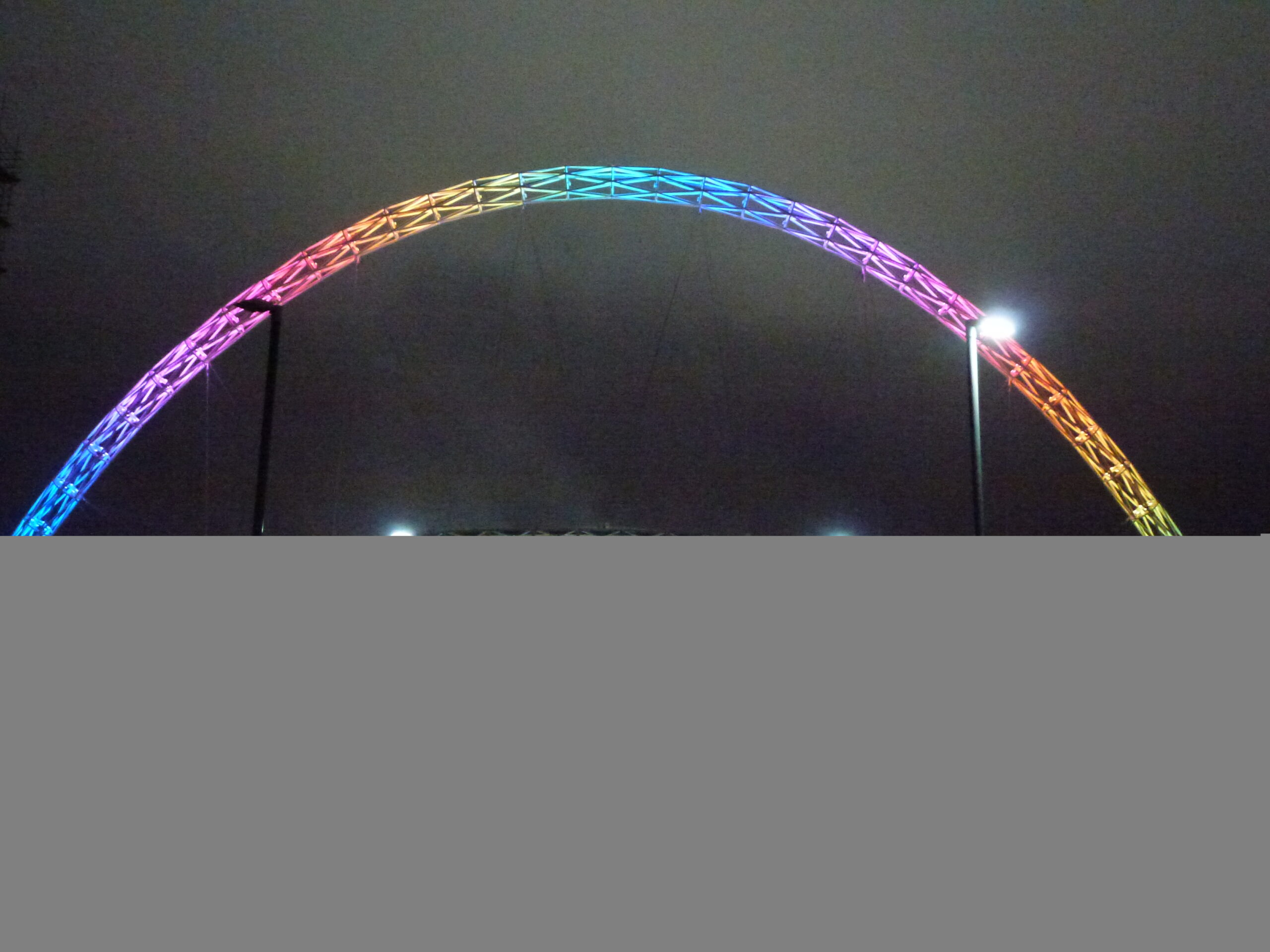 Concert crowd leaving Wembley Stadium at night after a stadium show