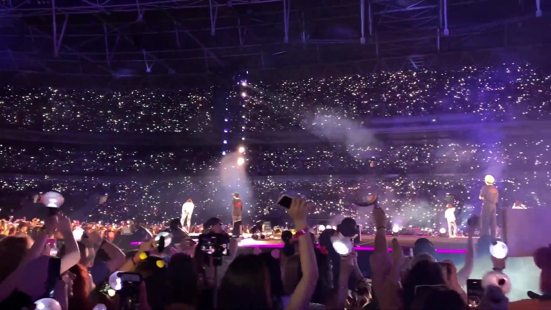 Crowds at a Wembley Stadium concert at night