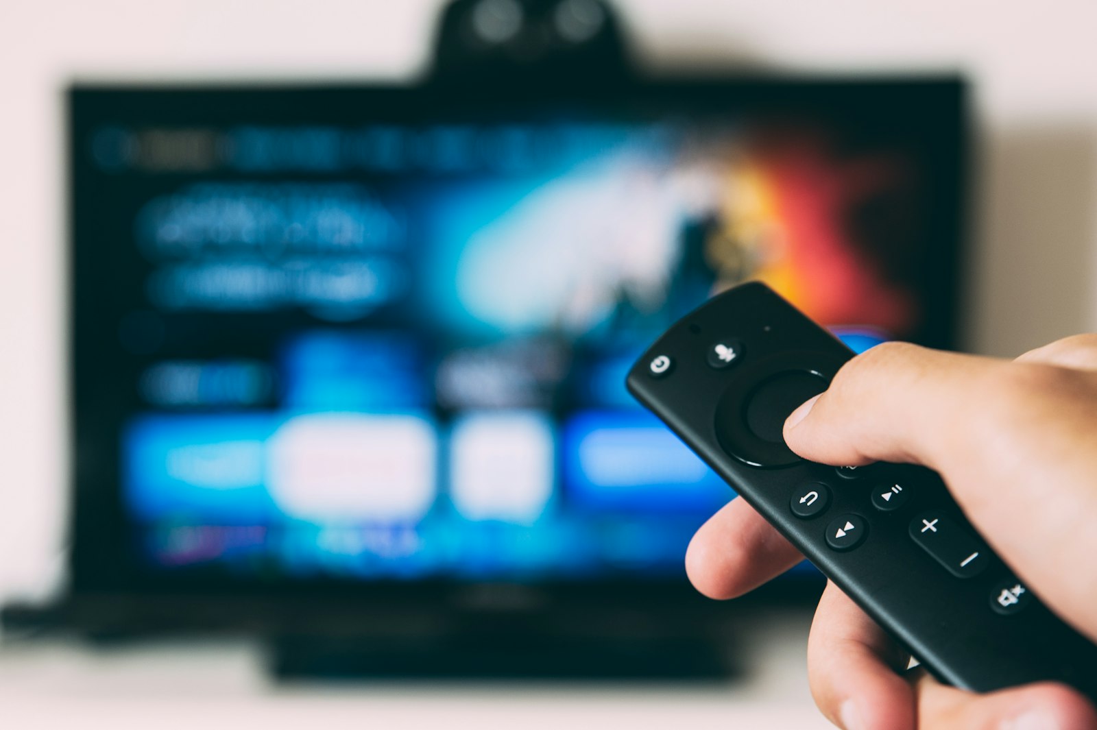 Television screen glowing in a darkened room