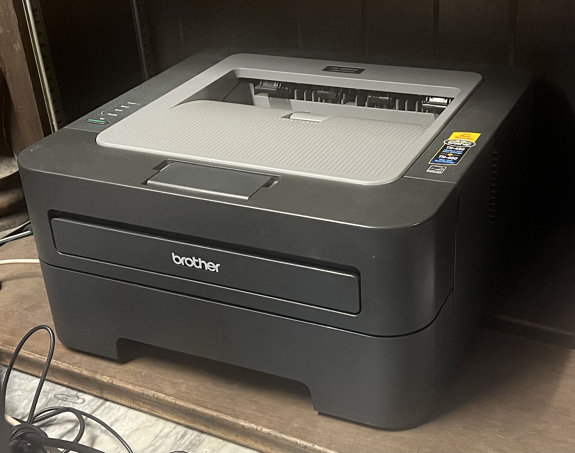Brother mono laser printer on a home shelf - the best home printer for homework and black and white documents