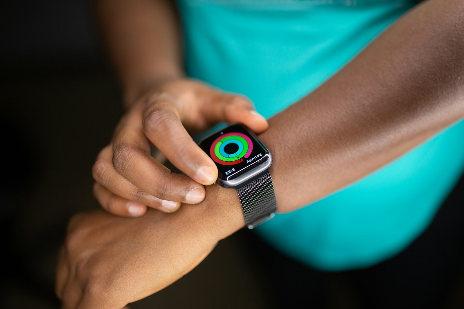 Apple Watch SE with white sport band on a wrist