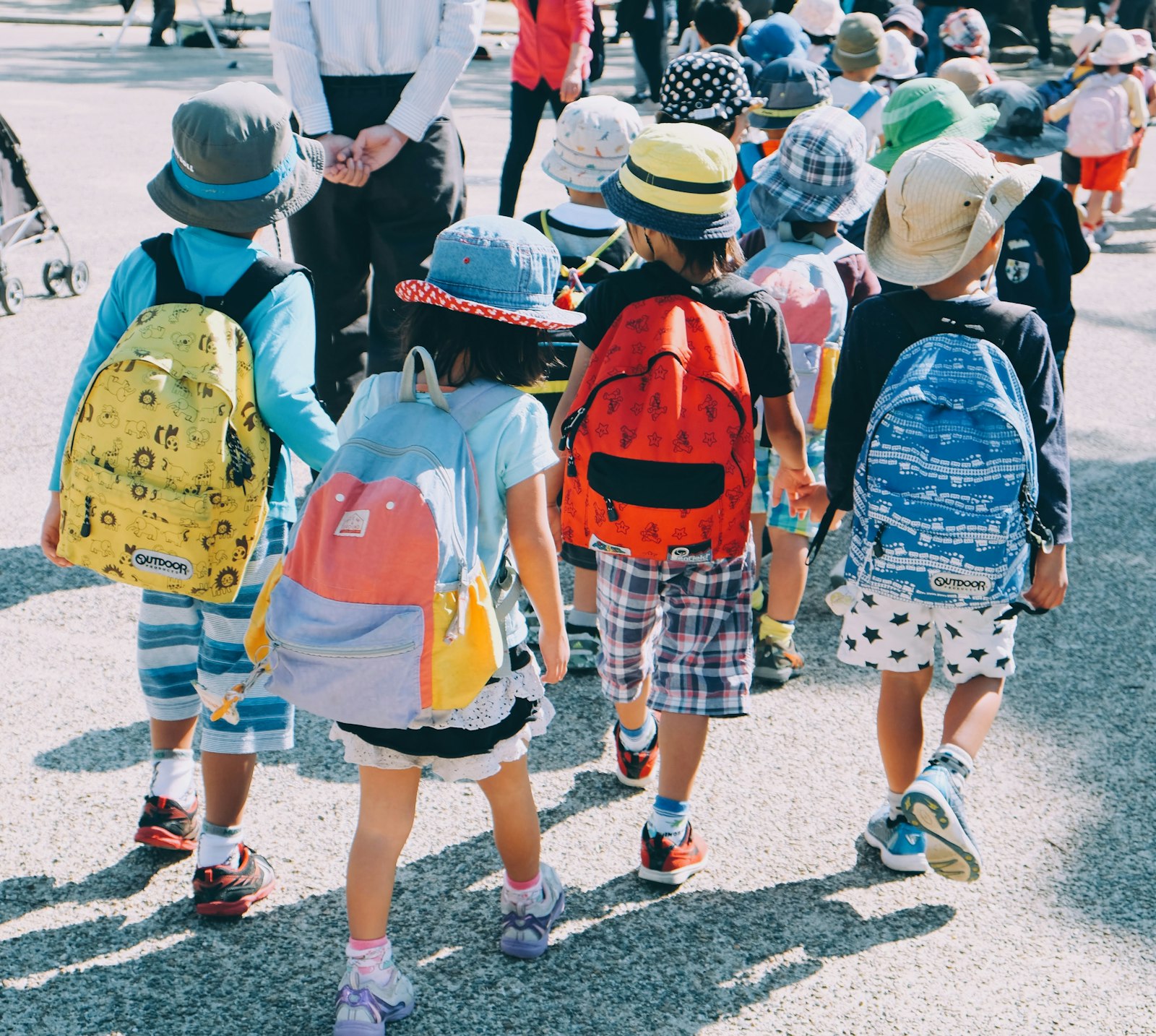 Children with backpacks on the walk to school