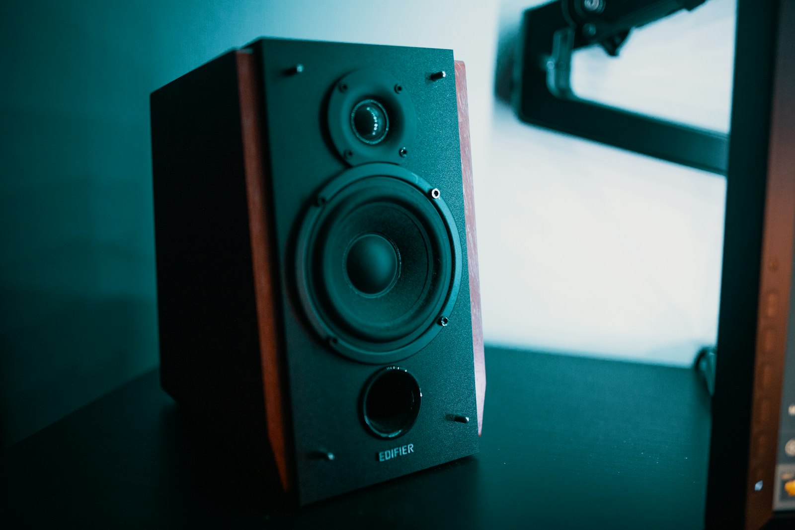 Compact home speaker on a sideboard showing the scale of budget audio kit