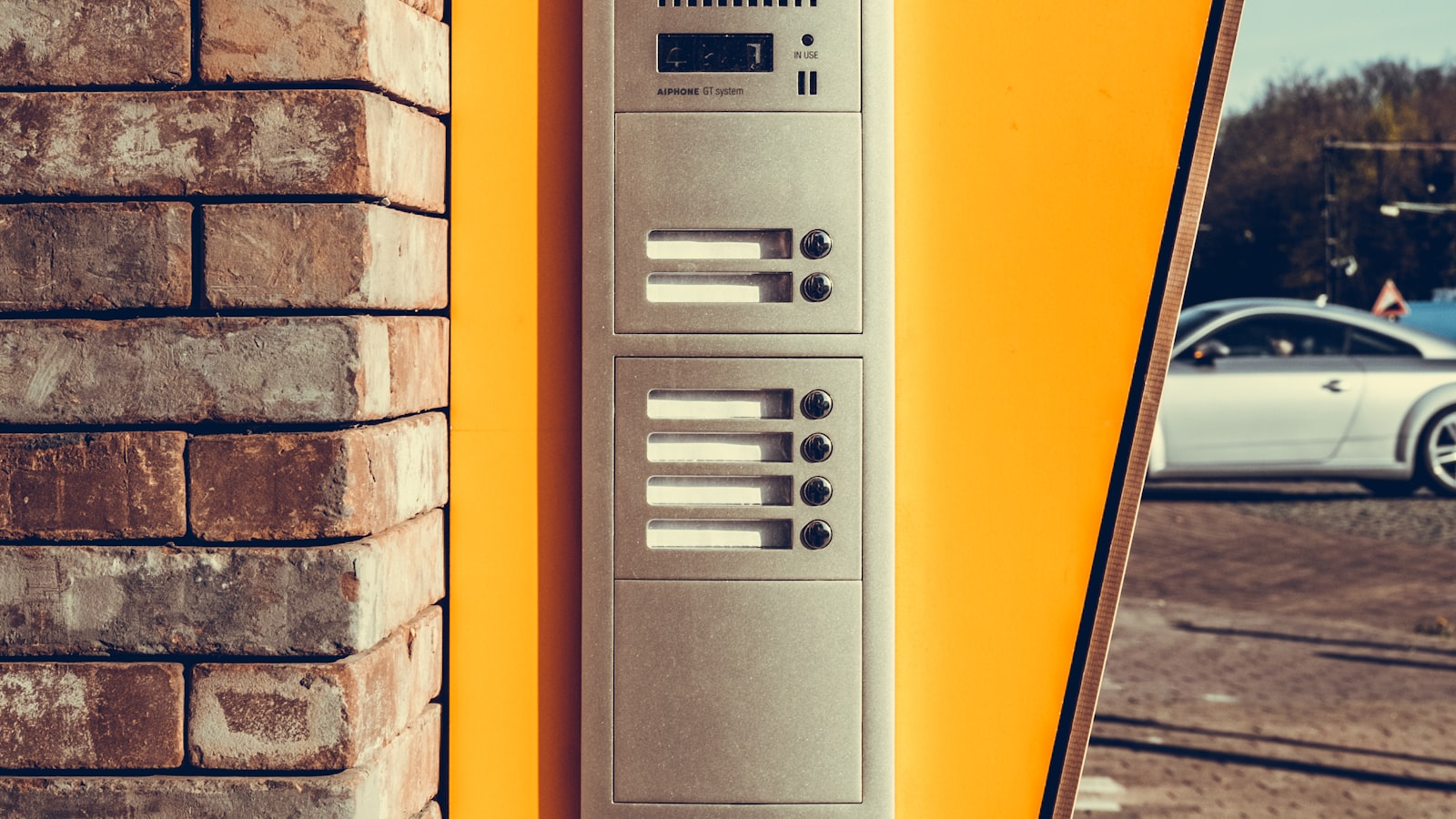 A wall-mounted home alarm keypad, the traditional alternative to a smart video doorbell