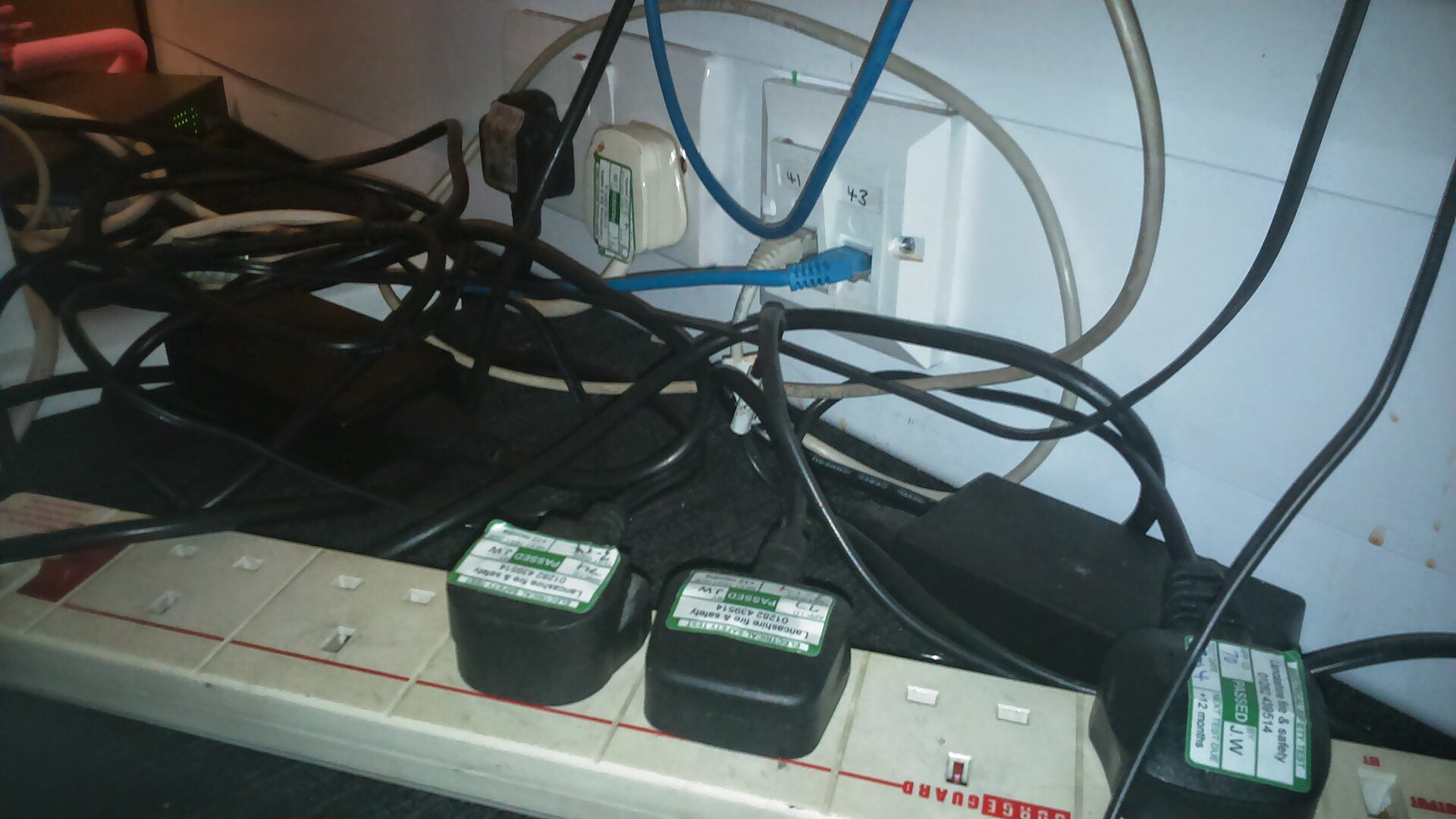 Several plugs crowded into an overloaded extension socket