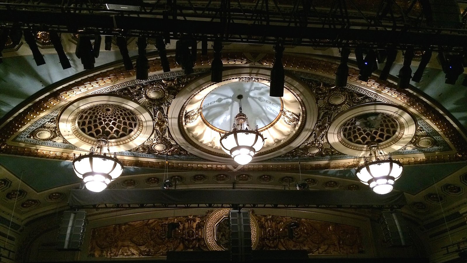 The ornate gilded ceiling and chandeliers of Theatre Royal, Drury Lane, seen from the stalls