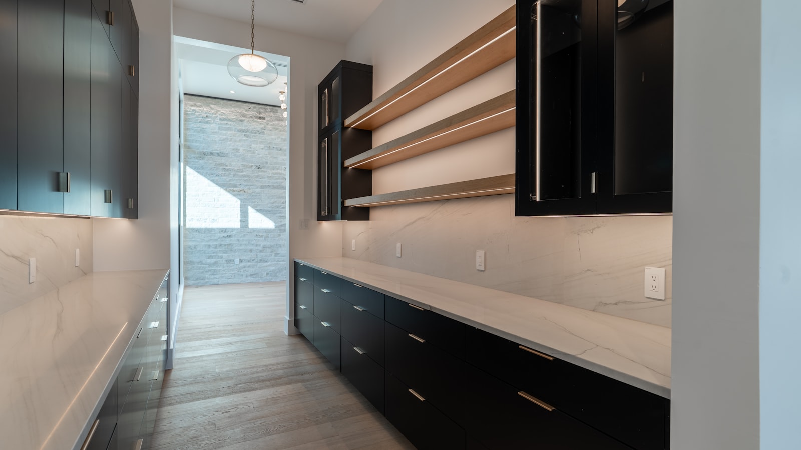 Freestanding pantry storage with wooden shelves - one of the kitchen island alternatives taking the island's storage job