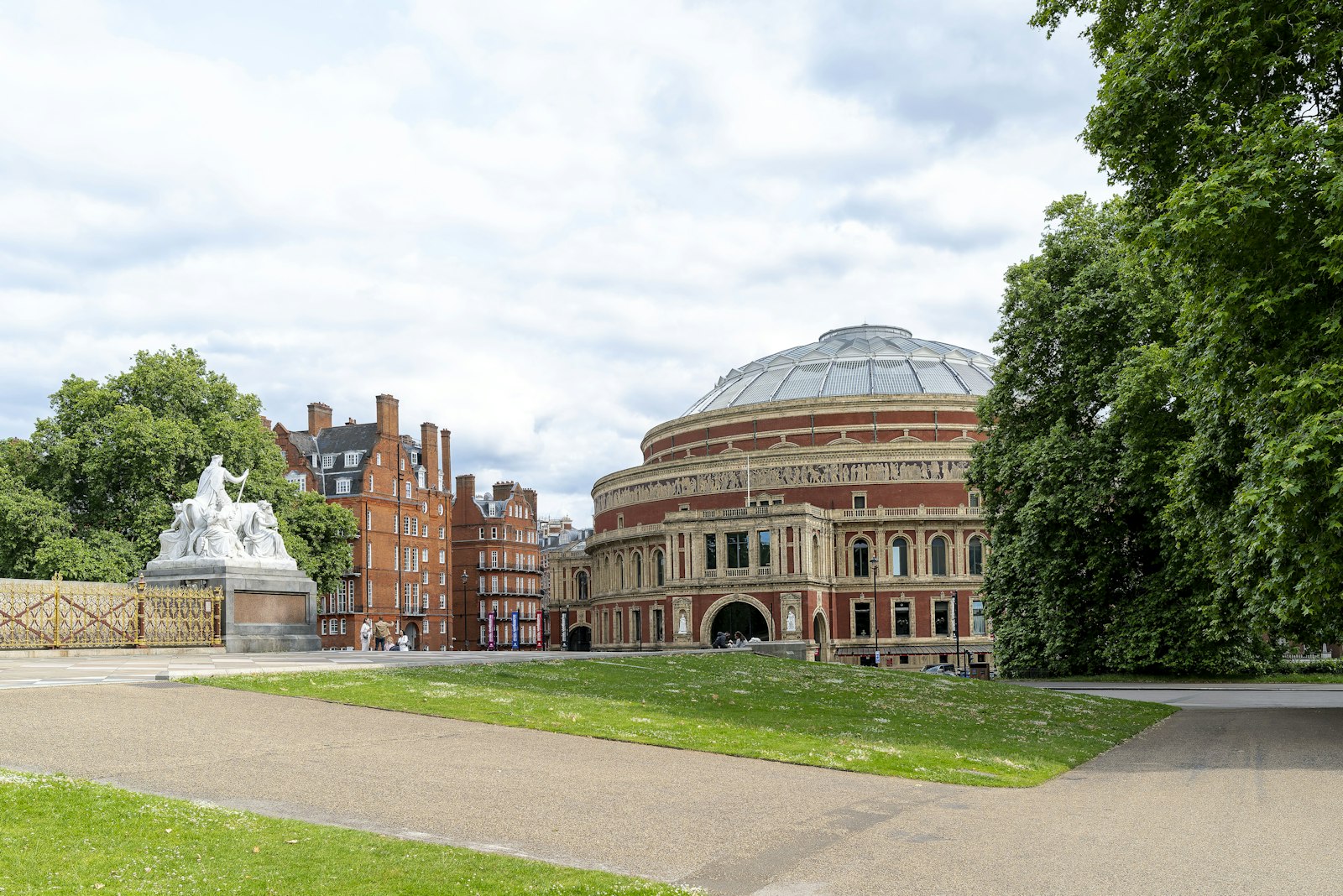 The Royal Albert Hall and its dome seen across late-summer greenery in South Kensington