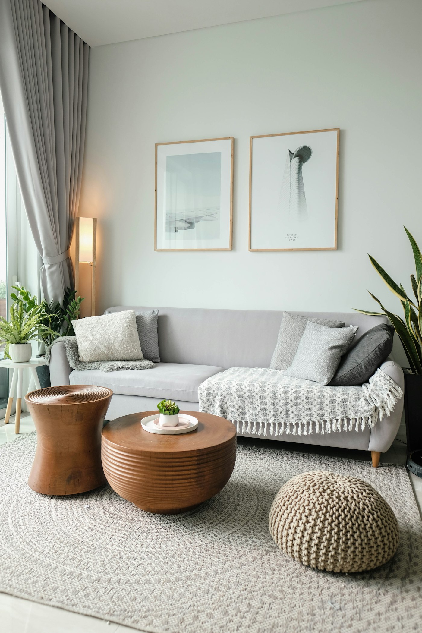Living room lighting done the lamp way: a warm floor lamp beside a grey sofa