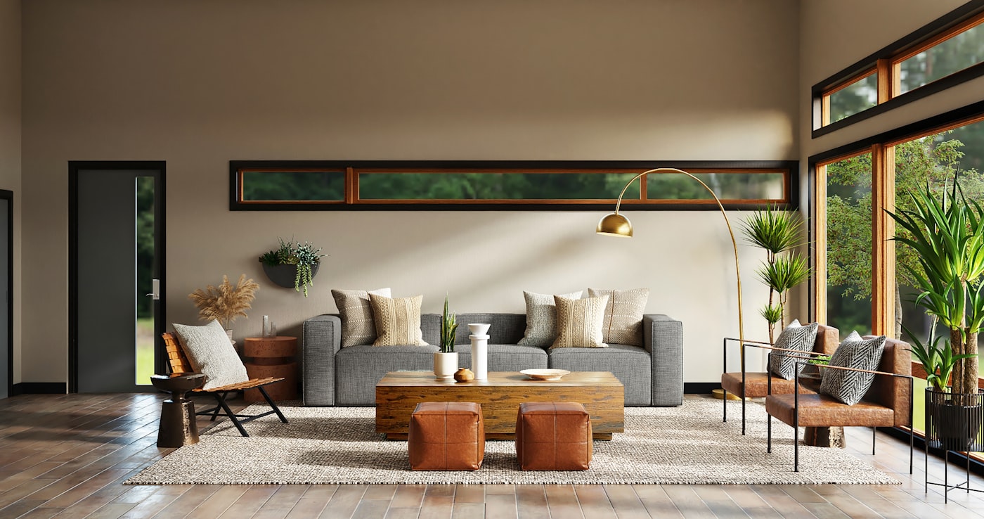 Arched brass floor lamp lighting a neutral living room in the evening