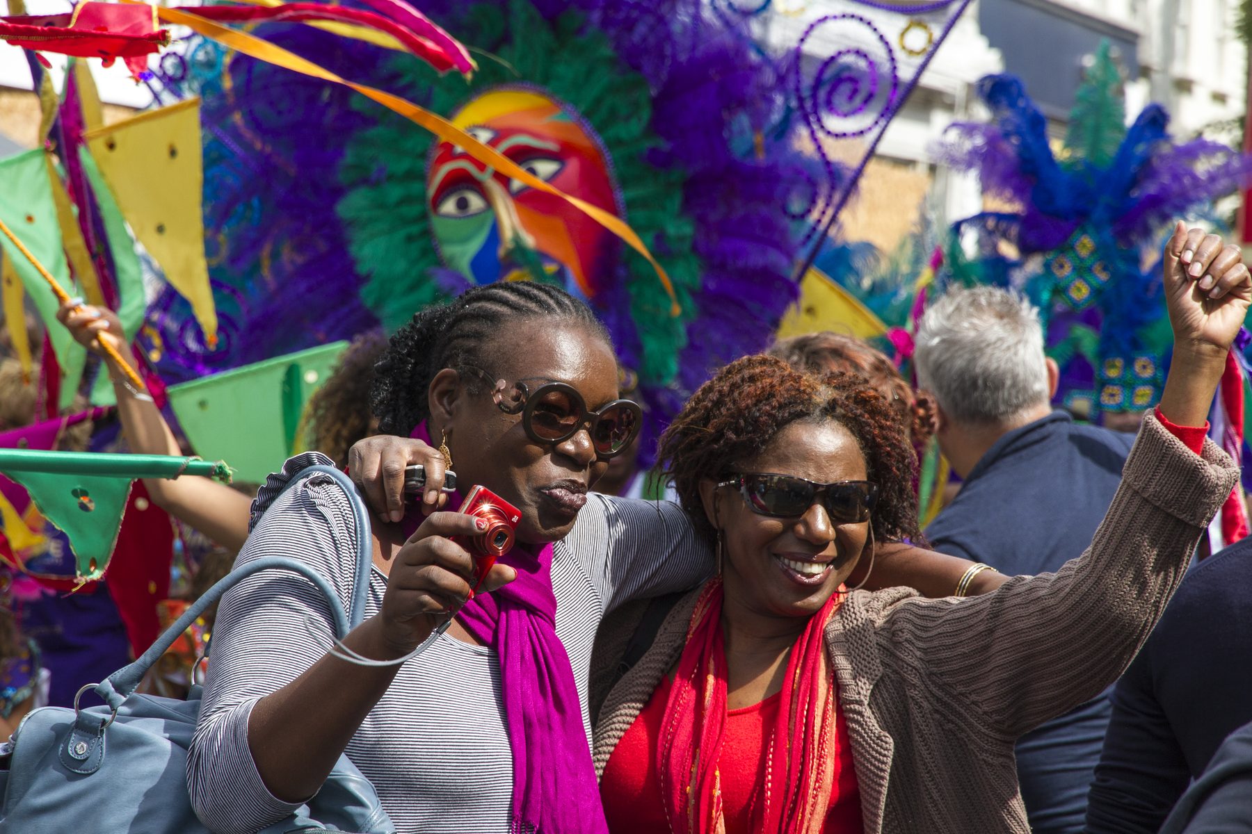 Crowds filling a residential street in Notting Hill during the August bank holiday carnival weekend