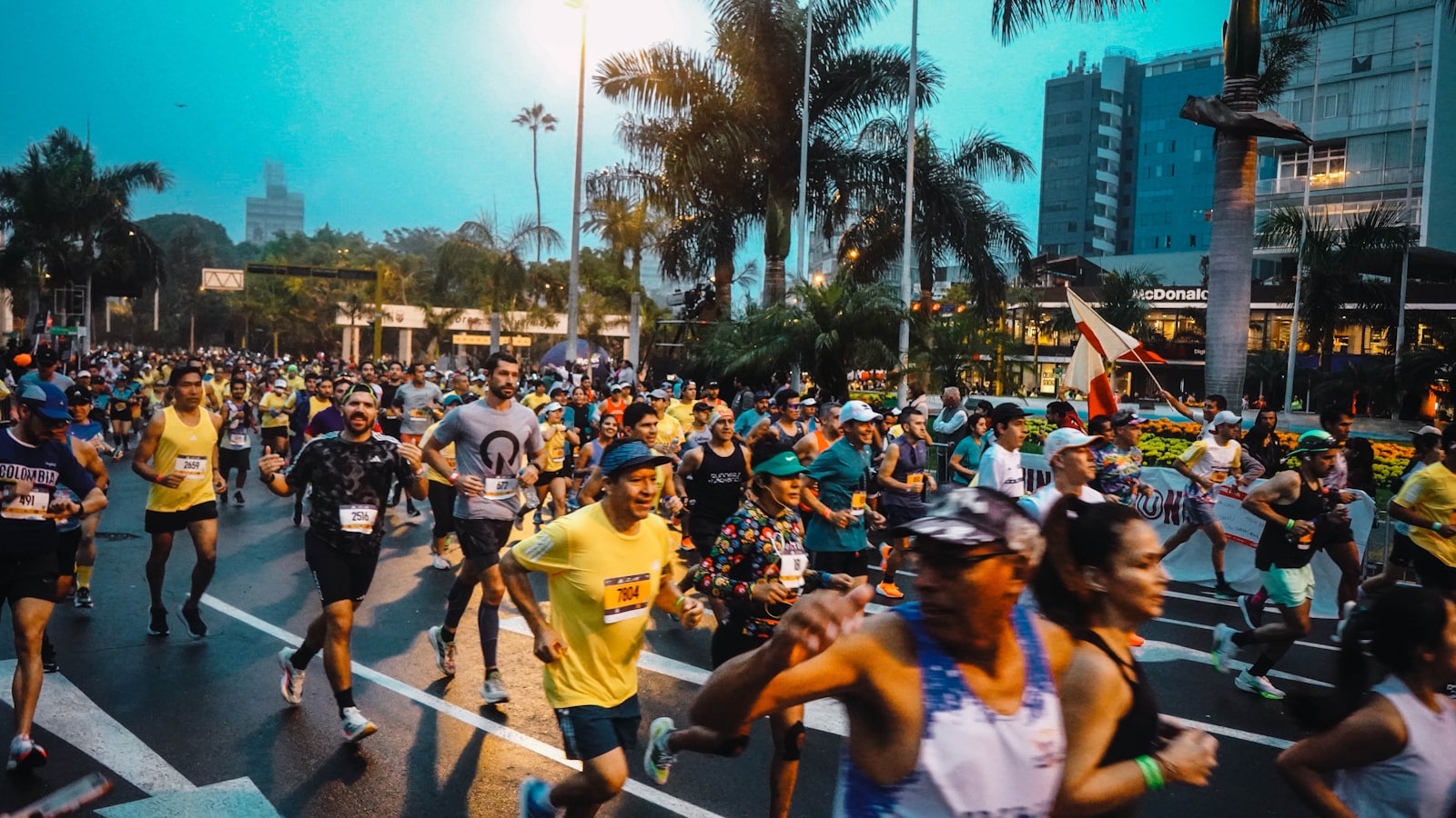 A large field of runners packed onto a city-centre half marathon course