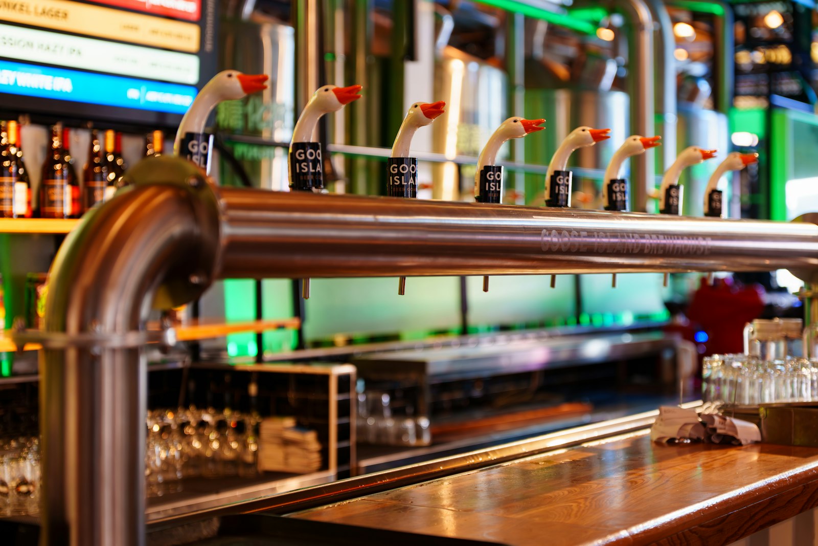 Row of beer taps along the counter of a British pub