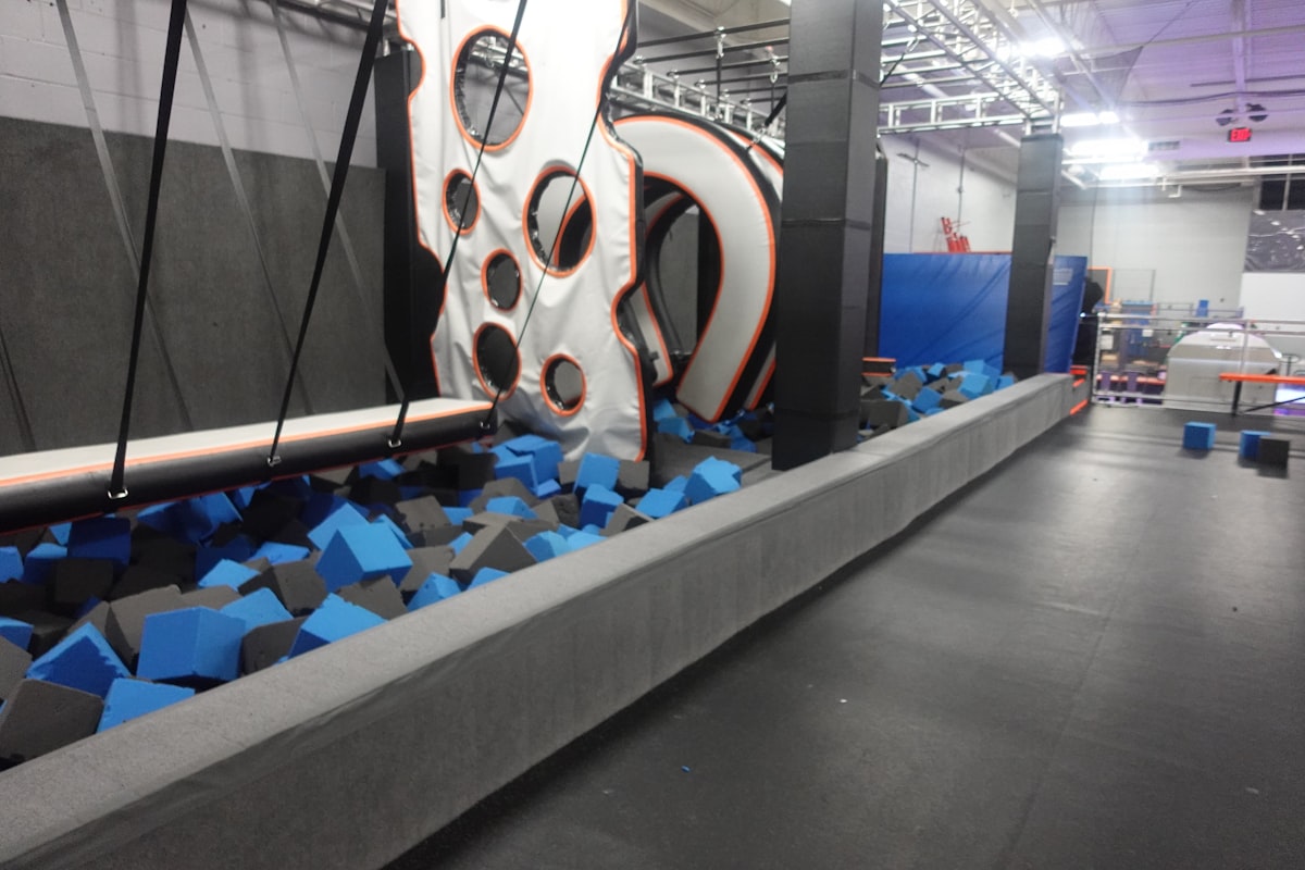 Indoor obstacle course with foam pit at a trampoline park