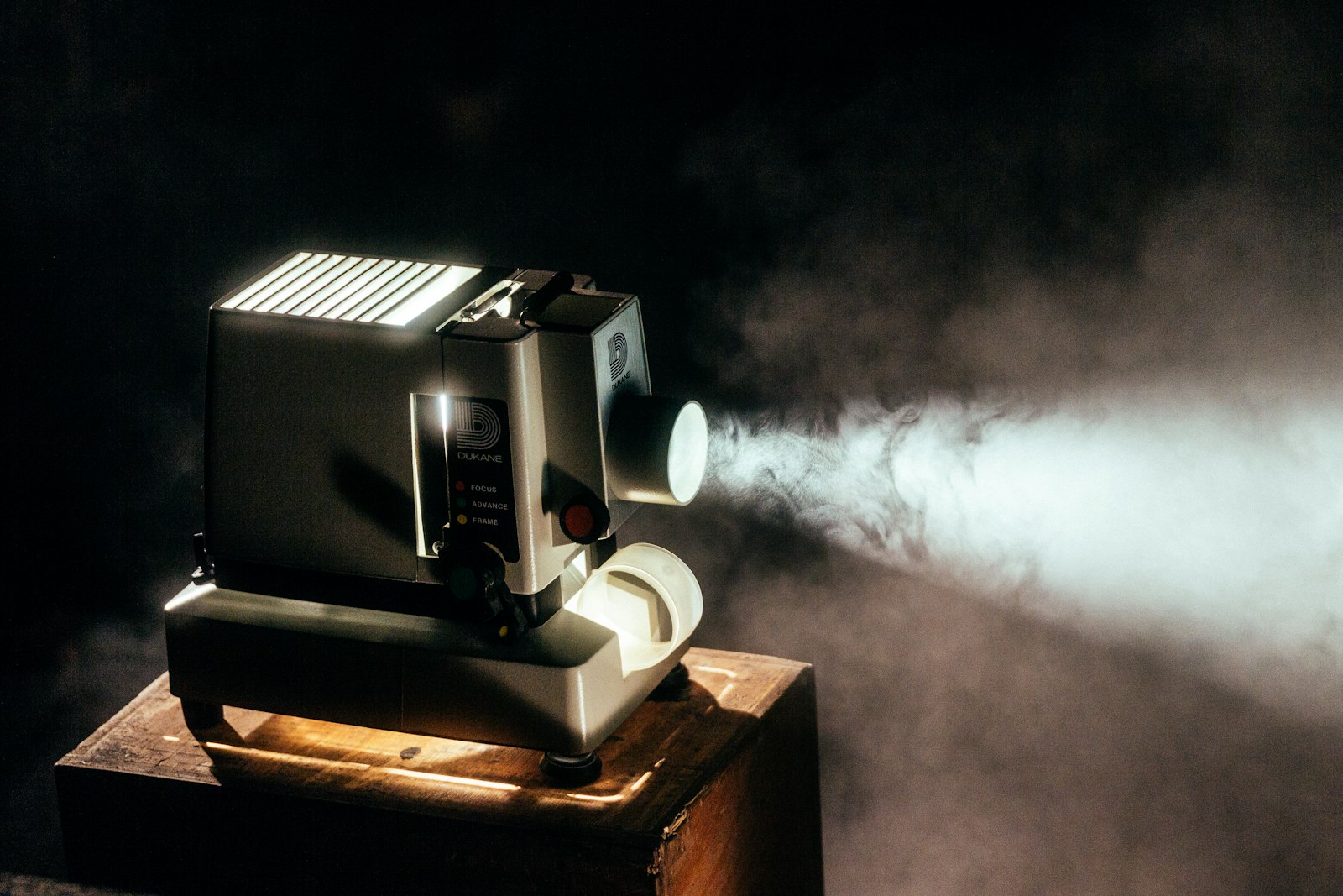 A film projector running in a dark room, the analogue format behind the sold-out 70mm screenings of The Odyssey