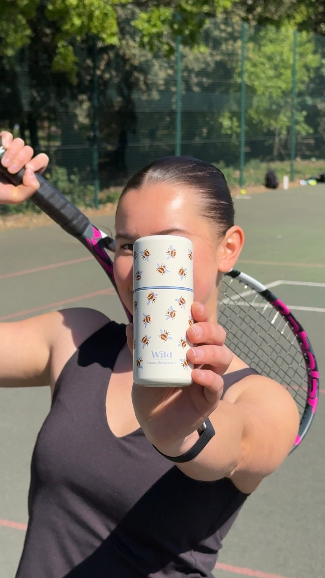 tennis player with Wild deodorant in summer sunshine