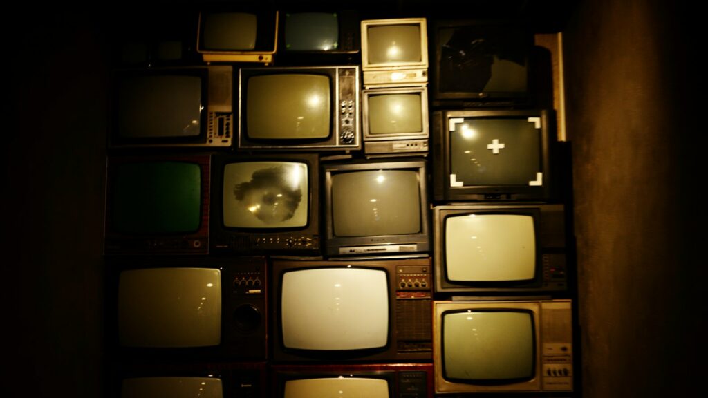 Stack of vintage television sets, the archive at the heart of our 70 Up review of ITV's final Up film